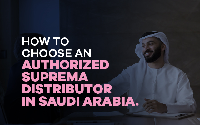 Smiling Saudi professional in meeting, representing search for authorized Suprema distributor in Saudi Arabia